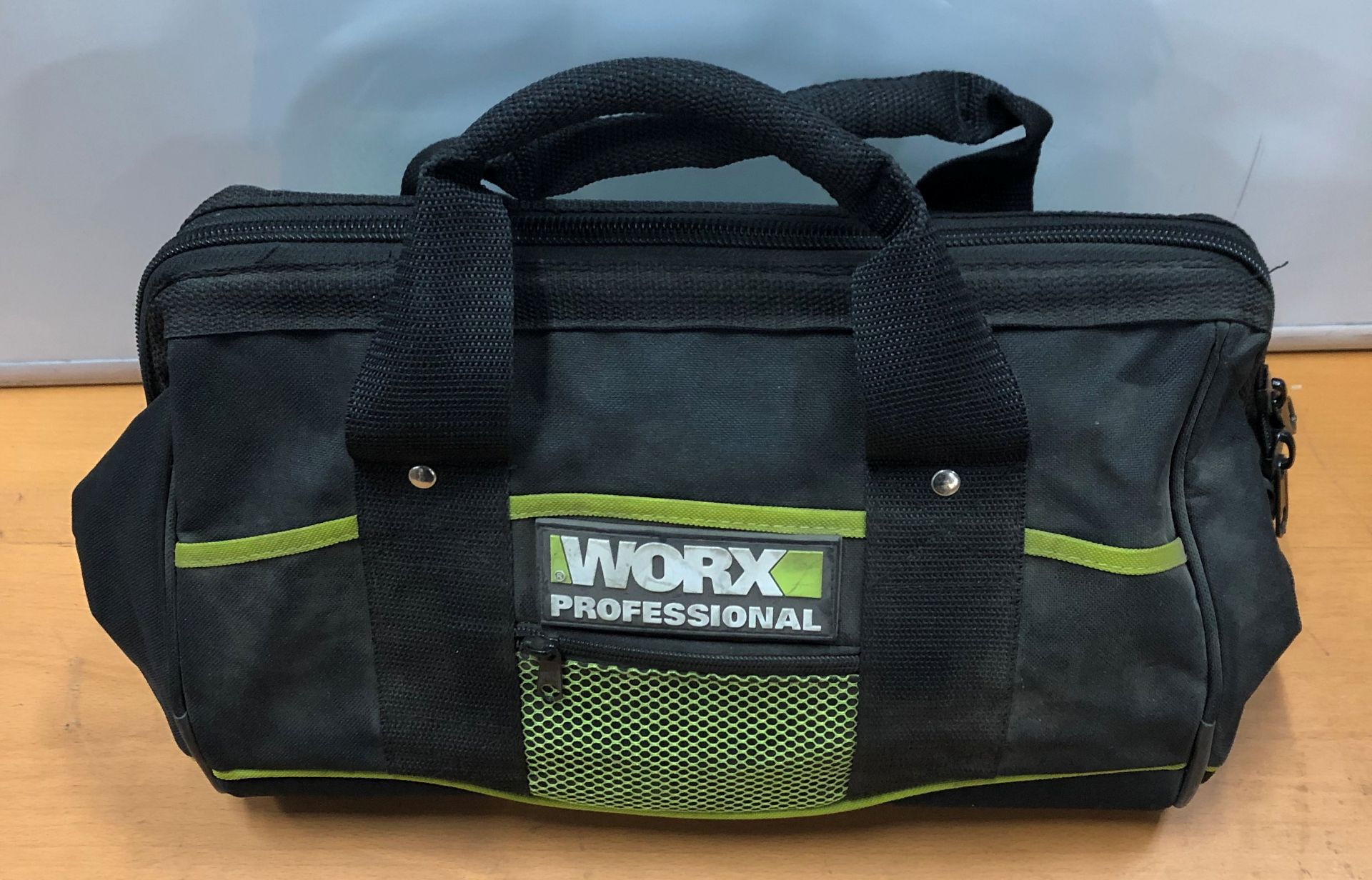 Worx bag containing: 1x 18v WA3522 Battery and Charger, 1x 12v WA3845 Charger, 1x 12v WU1