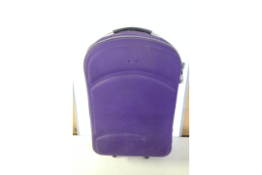 Purple Suitcase filled with plates and cups