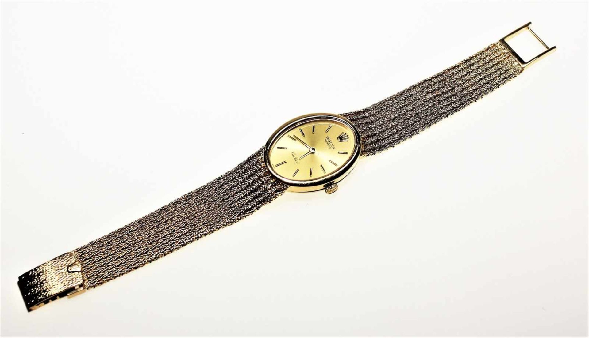 Feine, goldene Damen-Armbanduhr 750/f gest., ovales, goldfarbiges Zifferblatt bezeichnet Rolex,
