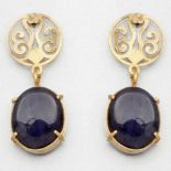 Paar Saphir-Ohrstecker als Cabochon750/- Gelbgold, gestempelt. Gewicht: 6,5g. 2 Saphire im