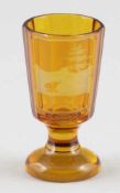 Schnapsglas als AndenkenglasUm 1860. - Bastei - Farbloses Glas, bernsteinfarbig lasiert. Facettiert.