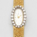 Ebel-Damenarmbanduhr mit Brillant-Lünette aus den 1960er JahrenFa. Ebel, Schweiz. 750/- Gelbgold und