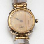 Omega Armbanduhr mit brasillanischem Achat und Uhren-StänderUhrmacher: Marian Hatlas. Edelstahl,