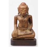BuddhaWohl Burma, 19. Jahrhundert. Stein. H. 21,5 cm. Linke Hand fehlt. Kopf mit Bohrung.