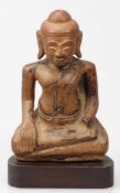 BuddhaWohl Burma, 19. Jahrhundert. Stein. H. 21,5 cm. Linke Hand fehlt. Kopf mit Bohrung.