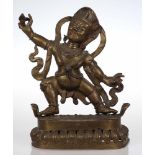 MahakalaWohl Tibet, um 1900. Bronze. H. 40 cm. Zweigeteilte Figur auf einem länglichen Sockel. In