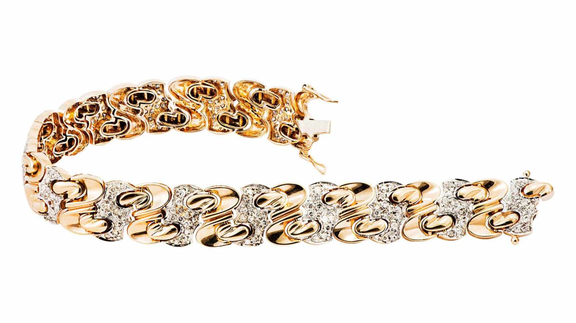 Bicolores Goldarmband mit Diamanten1950er Jahre. GG/WG 14 Kt. Umlaufend Fantasieglieder,