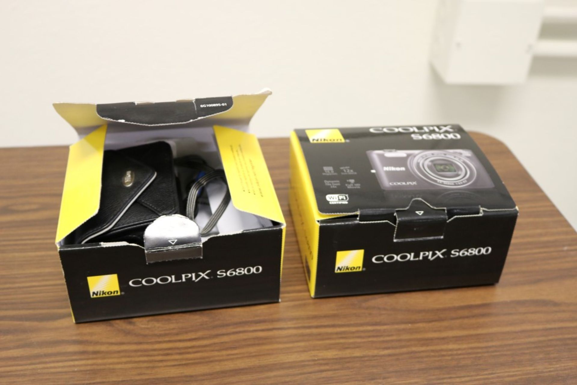 (2) Nikon Coolpix S6800, With Faux Leather Cases, Chargers Included. In Original Boxes