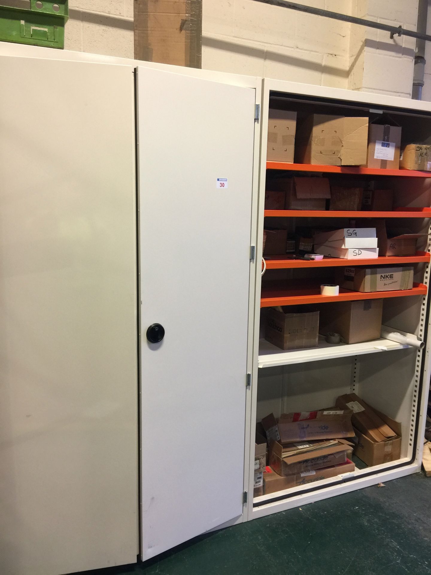 2 x Metal security Storage Cabinets one with 2 fitted doors and the other without & contents