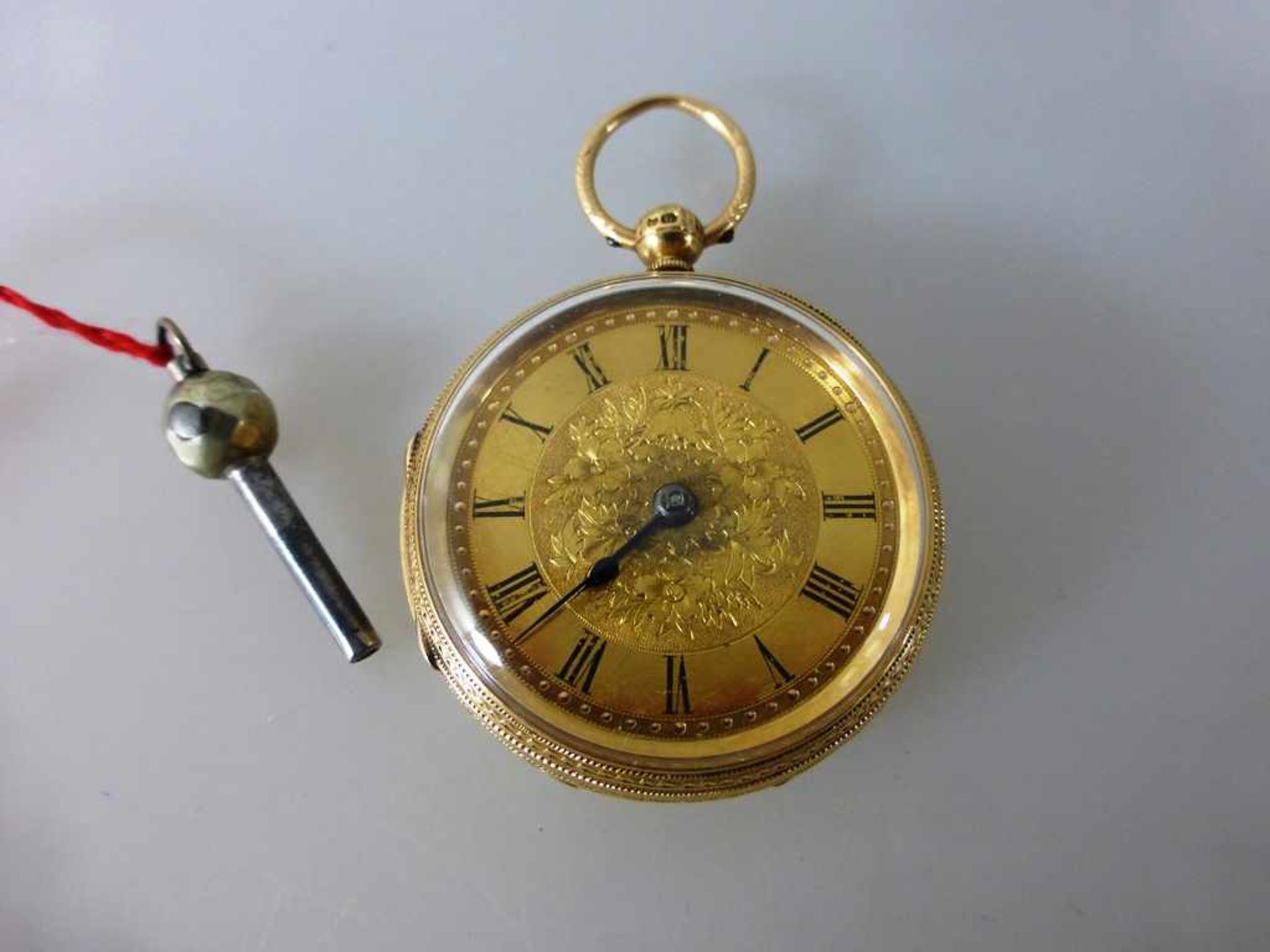 Schlüsseltaschenuhr, England um 1890, Gelbgold 750, fein verziert, num. 16582, d. 40,5mm,53,5g.,