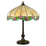 A Handel bronze lamp base with associated leaded glass shade