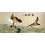 A large Oriental embroidery of two eagles flying above the waves