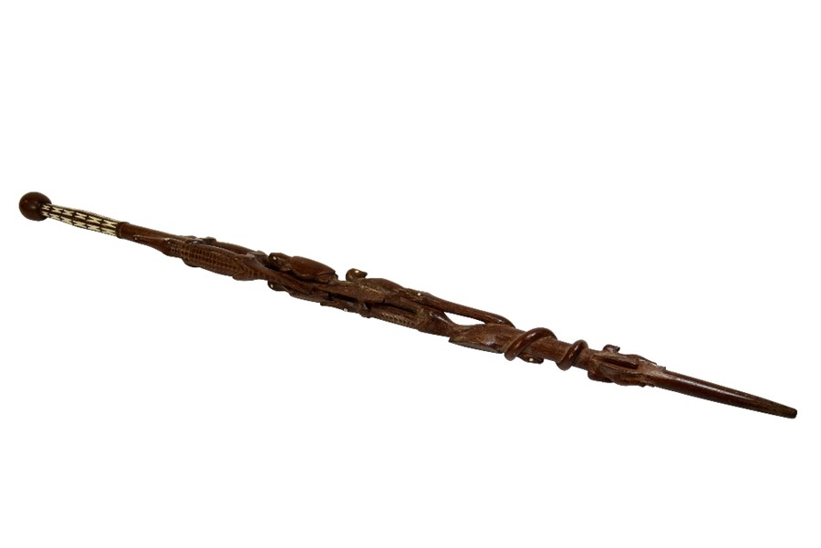 A tribal carved wood staff, 19th or 20th century