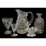 A George III moulded and cut glass spirit decanter, jug, rummer etc.