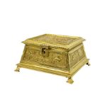 A relief moulded cast gilt metal casket