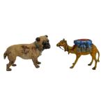An Austrian cold painted bronze camel pin cushion and a figure of a dog