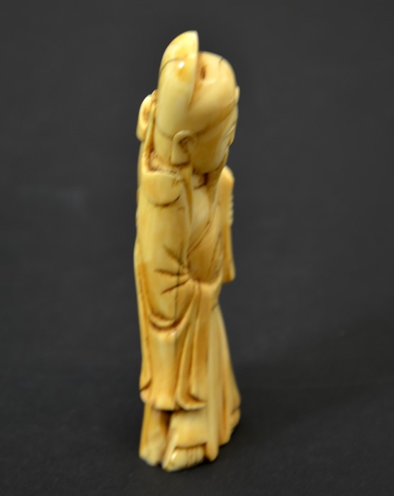 A Chinese carved walrus ivory figure of an immortal - Image 4 of 5