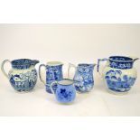 A collection of Staffordshire blue and white transfer printed jugs