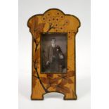 An Arts and Crafts marquetry photograph frame, circa 1900