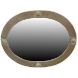 An Arts and Crafts patinated brass mirror