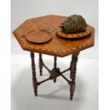 An Anglo Indian colonial tortoise tea caddy on stand, together with matching folding tea table