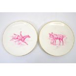 Lucien Boullemier for Minton, a pair of puce painted plates with horses and riders