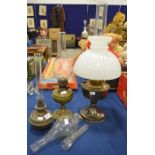 Three glass oil lamps