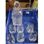An English cut glass spirit decanter and six hand etched glasses