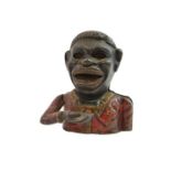 A late 19th century Black Boy money box,