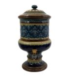 A Doulton blue and brown decroated water filter, 48cm high