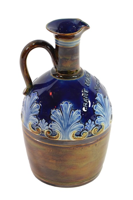 A Doulton Lambeth artware whisky ewer with blue glazed top, impressed marks to base and GRANT MACKAY