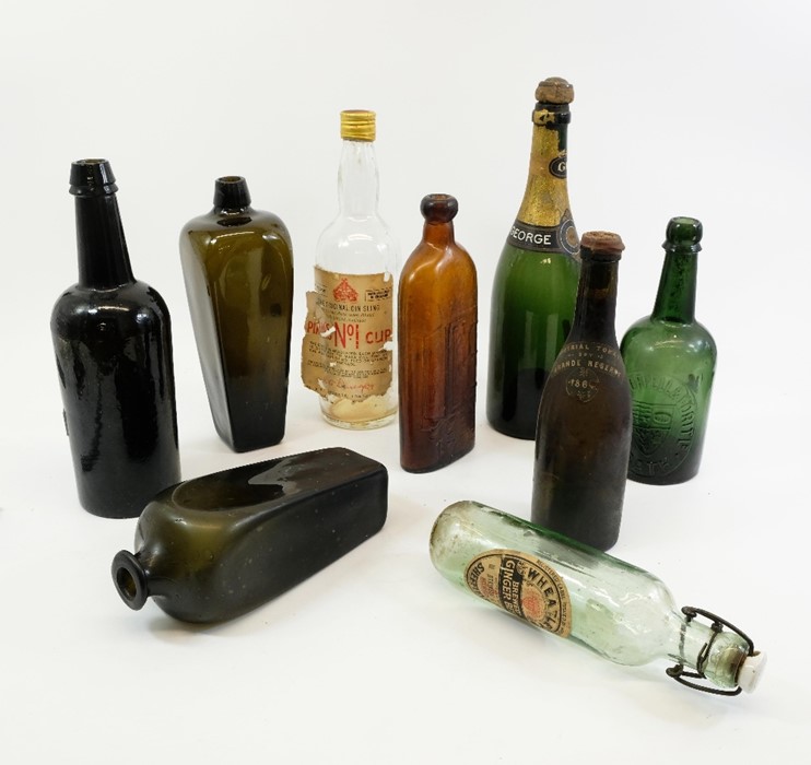 A quantity of old bottles, mostly 19th Century, including Dutch pig-snout case gin with another, a w