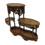 A Chinese carved hardwood multi tier stand