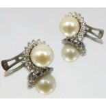 A pair of pearl and diamond cluster stud earrings