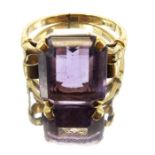 An emerald cut amethyst and 9 carat gold ring