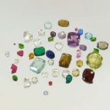 A collection of loose semi precious gem stones