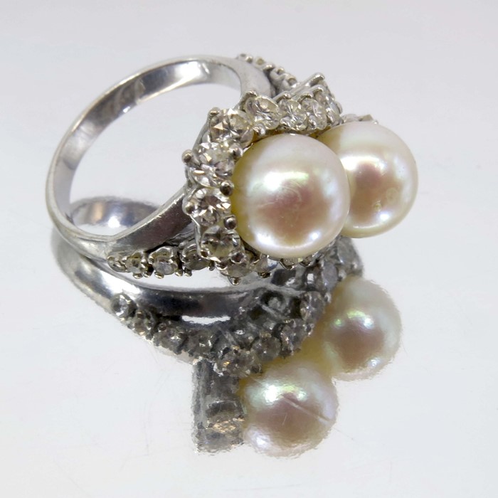 A pearl and diamond ring, set in 18 carat white gold
