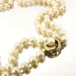 A double string pearl necklace with 9 carat gold and pearl clasp