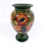 William Moorcroft for Liberty and Co., a Pomegranate on ochre vase