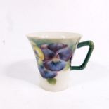 William Moorcroft for James MacIntyre, a small Pansy on white cup