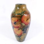 William Moorcroft for Liberty and Co., a Pomegranate on ochre vase