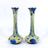 William Moorcroft for James MacIntyre, a pair of Florian Ware Peacock vases