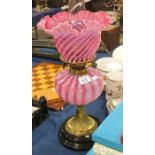 A Victorian oil lamp, the frilled shade and well w