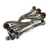 Bernard Instone, an Art Deco silver, marcasite and garnet brooch