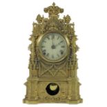 A Gothic revival cast and gilt metal clock, C and N Muller