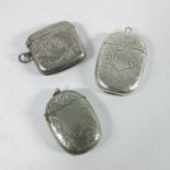 Two Edwardian silver vesta cases and a white metal example