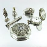 A collection of silver including nurses buckles, novelty vesta case