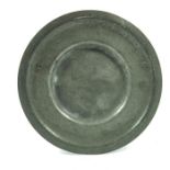 A George I pewter ogee rimmed plate