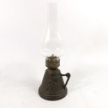 An Aesthetic Movement cast iron chamber oil lamp