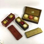 Three boxes of Victorian ivory billiard balls